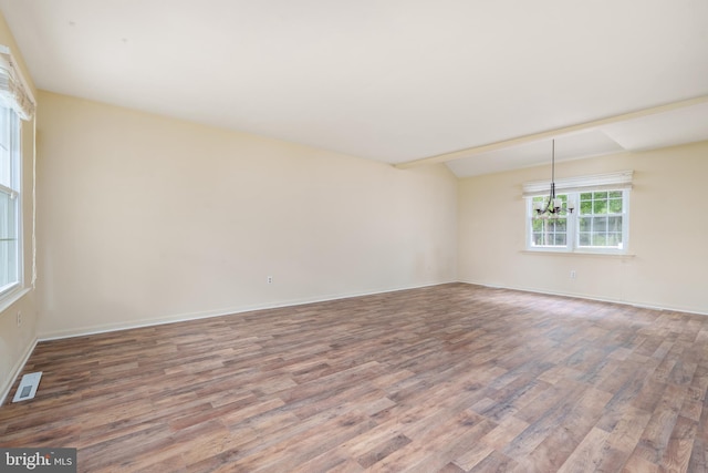 37 W Kapok, Newark, DE 19702 - spare room featuring wood finished floors, a chandelier, baseboards, and vaulted ceiling