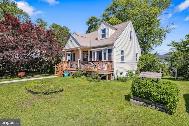 314 Holy Cross Rd, Baltimore, MD 21225 - view of front facade with a front lawn, a shingled roof, and a wooden deck