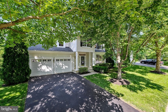 17542 Falls Pl, Round Hill, VA 20141 - view of front of house with driveway, a front lawn, a shingled roof, and an attached garage