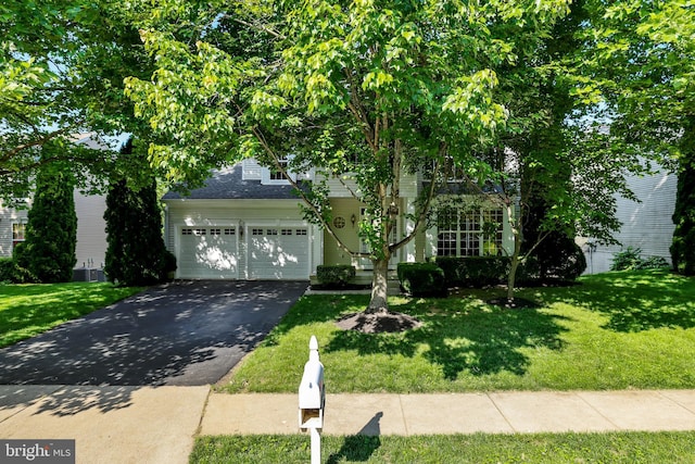 17542 Falls Pl, Round Hill, VA 20141 - obstructed view of property with asphalt driveway, a front yard, and central AC unit