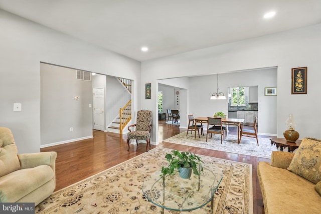 17542 Falls Pl, Round Hill, VA 20141 - living room featuring wood finished floors, stairs, recessed lighting, baseboards, and a chandelier