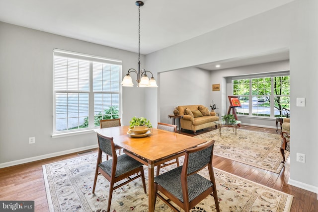 17542 Falls Pl, Round Hill, VA 20141 - dining area featuring a chandelier, plenty of natural light, baseboards, and wood finished floors