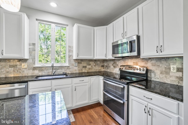 17542 Falls Pl, Round Hill, VA 20141 - kitchen featuring stainless steel appliances, a sink, dark wood-style flooring, white cabinets, and recessed lighting