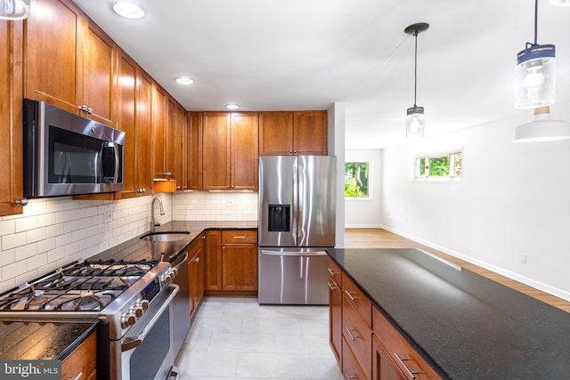 3603 Astoria Rd, Kensington, MD 20895 - kitchen with appliances with stainless steel finishes, tasteful backsplash, brown cabinets, recessed lighting, and light tile patterned floors