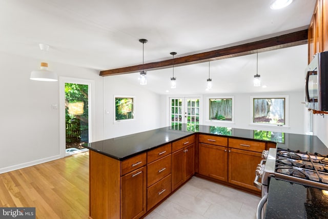 3603 Astoria Rd, Kensington, MD 20895 - kitchen with brown cabinetry, appliances with stainless steel finishes, beamed ceiling, french doors, and pendant lighting