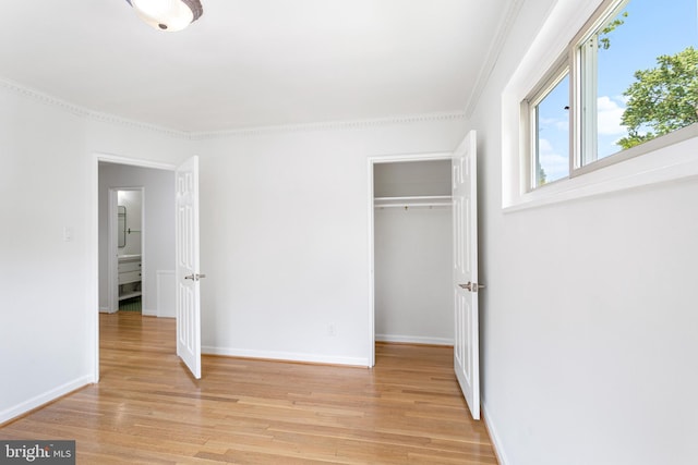 3603 Astoria Rd, Kensington, MD 20895 - unfurnished bedroom with light wood-style floors, a closet, and ornamental molding