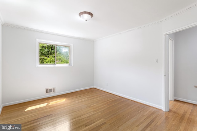 3603 Astoria Rd, Kensington, MD 20895 - unfurnished room with light wood finished floors and ornamental molding