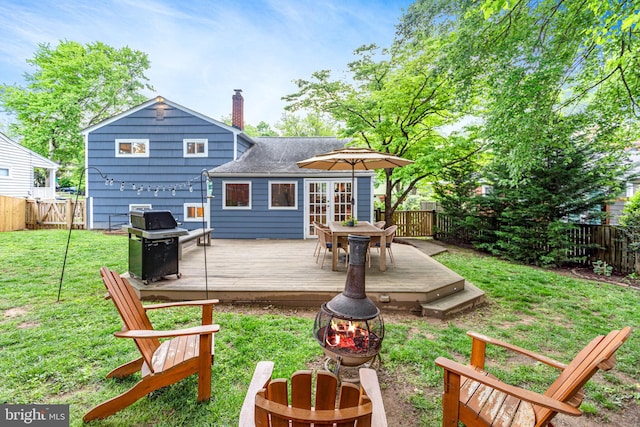 3603 Astoria Rd, Kensington, MD 20895 - back of house with a chimney, a fenced backyard, a wooden deck, and outdoor dining area