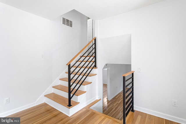 3603 Astoria Rd, Kensington, MD 20895 - staircase with wood finished floors and baseboards
