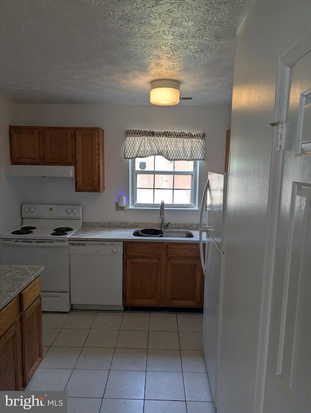 3002 Brinkley Station Dr, Temple Hills, MD 20748 - kitchen with white appliances, a sink, brown cabinetry, a textured ceiling, and ventilation hood