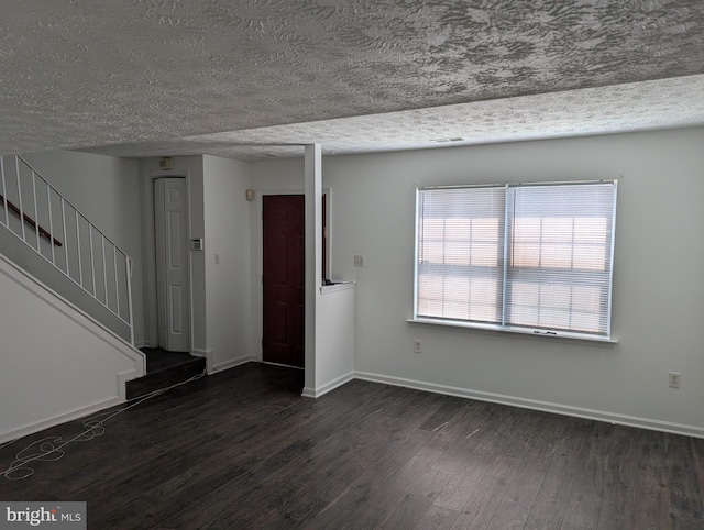 3002 Brinkley Station Dr, Temple Hills, MD 20748 - foyer entrance featuring dark wood-type flooring, stairway, baseboards, and a textured ceiling
