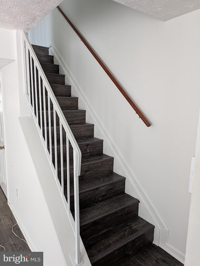 3002 Brinkley Station Dr, Temple Hills, MD 20748 - stairs featuring wood finished floors and a textured ceiling