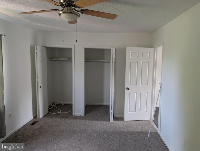 3002 Brinkley Station Dr, Temple Hills, MD 20748 - unfurnished bedroom featuring two closets, carpet floors, a textured ceiling, and ceiling fan