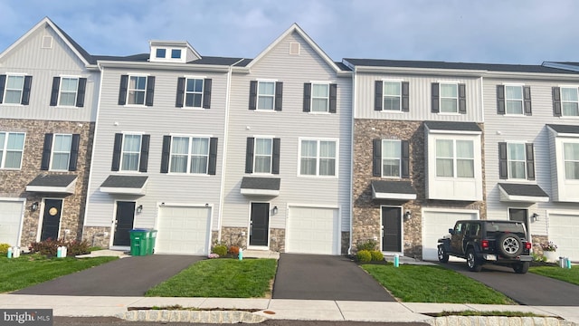 4904 Brookside Ct, Coopersburg, PA 18036 - view of property featuring stone siding, a garage, and driveway