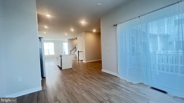 4904 Brookside Ct, Coopersburg, PA 18036 - empty room with dark wood-style floors, baseboards, stairway, recessed lighting, and a sink