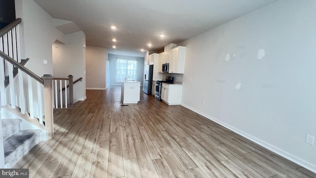 4904 Brookside Ct, Coopersburg, PA 18036 - unfurnished living room with wood finished floors, baseboards, and recessed lighting