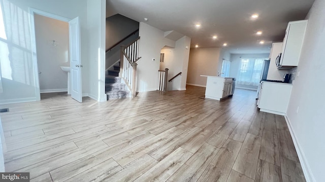 4904 Brookside Ct, Coopersburg, PA 18036 - unfurnished living room featuring light wood finished floors, baseboards, recessed lighting, and stairway