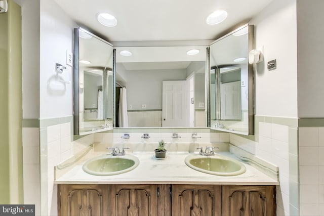 805 Islington St, Silver Spring, MD 20910 - full bath featuring double vanity, tile walls, and wainscoting