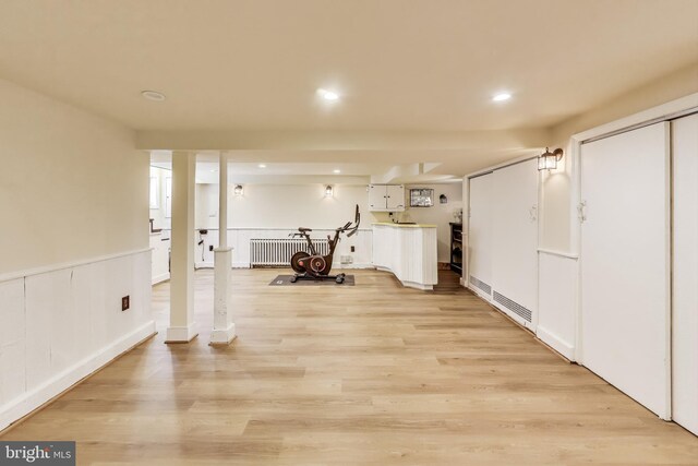 805 Islington St, Silver Spring, MD 20910 - workout room with radiator heating unit, light wood-type flooring, recessed lighting, and bar area