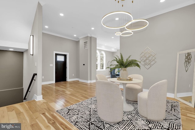 11921 Coronada Pl, Kensington, MD 20895 - dining space featuring light wood finished floors, crown molding, baseboards, and recessed lighting