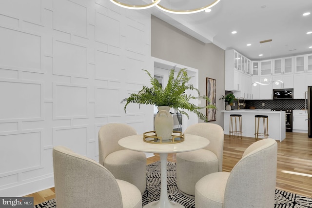 11921 Coronada Pl, Kensington, MD 20895 - dining room with light wood-style flooring and recessed lighting
