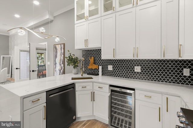 11921 Coronada Pl, Kensington, MD 20895 - kitchen with dishwashing machine, wine cooler, ornamental molding, a peninsula, and backsplash