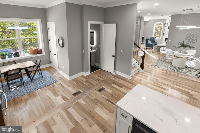 11921 Coronada Pl, Kensington, MD 20895 - interior space featuring light wood-type flooring, baseboards, crown molding, healthy amount of natural light, and recessed lighting