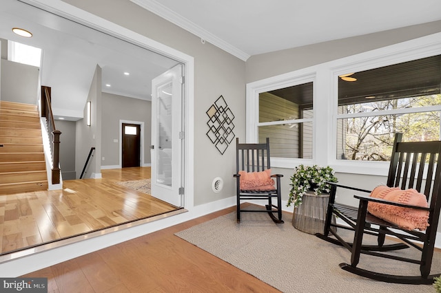 11921 Coronada Pl, Kensington, MD 20895 - living area featuring wood finished floors, ornamental molding, baseboards, stairway, and recessed lighting