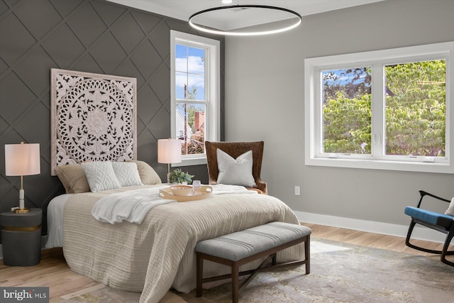 11921 Coronada Pl, Kensington, MD 20895 - bedroom with an accent wall, baseboards, and wood finished floors