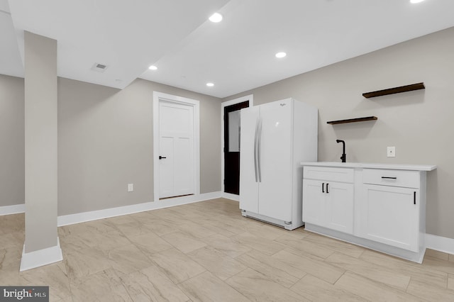 11921 Coronada Pl, Kensington, MD 20895 - kitchen featuring freestanding refrigerator, open shelves, baseboards, white cabinetry, and recessed lighting