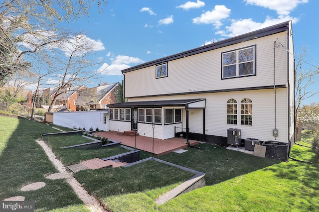 11921 Coronada Pl, Kensington, MD 20895 - rear view of property featuring a sunroom, a yard, a deck, and central AC
