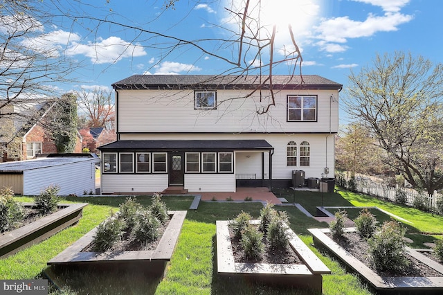 11921 Coronada Pl, Kensington, MD 20895 - back of house with a garden, a sunroom, an outdoor structure, and entry steps