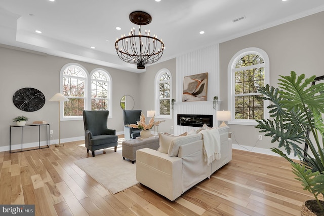 11921 Coronada Pl, Kensington, MD 20895 - living room with ornamental molding, a fireplace, baseboards, recessed lighting, and light wood-style flooring