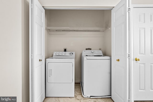 7432 Hindon Cir Unit B1-204, Windsor Mill, MD 21244 - laundry area featuring separate washer and dryer and light marble finish floors