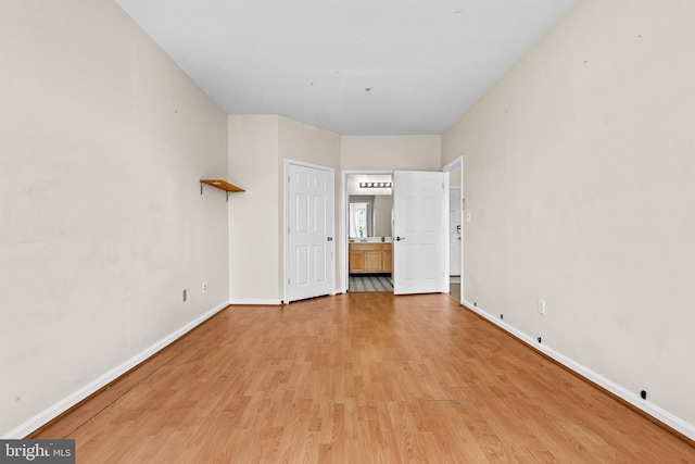 7432 Hindon Cir Unit B1-204, Windsor Mill, MD 21244 - unfurnished bedroom featuring light wood finished floors and ensuite bath
