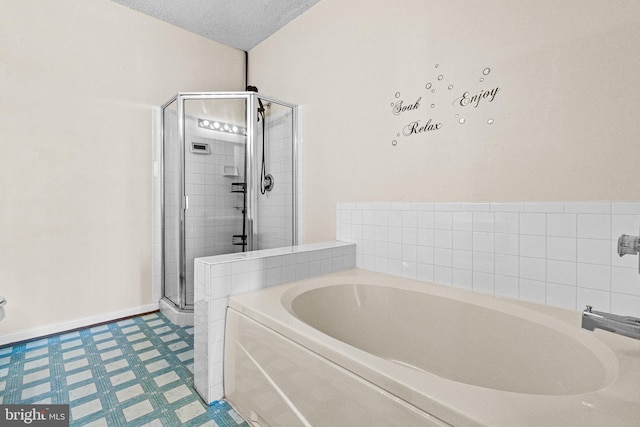7432 Hindon Cir Unit B1-204, Windsor Mill, MD 21244 - bathroom featuring a bath, a shower stall, and tile patterned floors