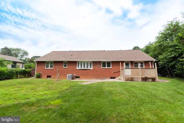 34 Georgetown Rd, Bordentown, NJ 08505 - rear view of property featuring a lawn, a patio, and brick siding