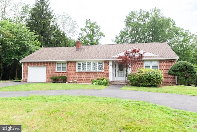 34 Georgetown Rd, Bordentown, NJ 08505 - single story home featuring an attached garage, driveway, a chimney, and brick siding