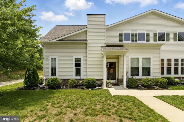 135 Jacobia Dr Unit H-3, Pasadena, MD 21122 - view of front of home with a front lawn, a chimney, and a shingled roof