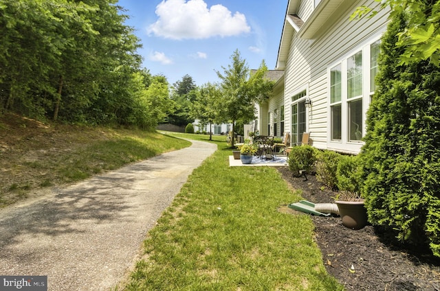 135 Jacobia Dr Unit H-3, Pasadena, MD 21122 - view of grassy yard featuring a patio
