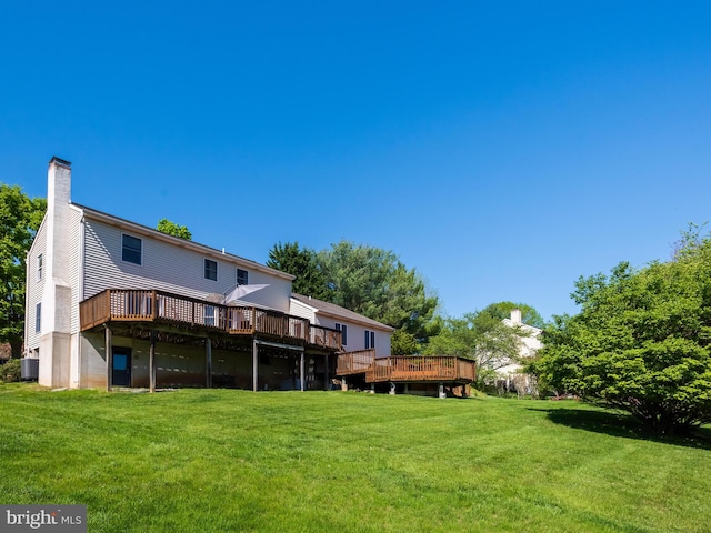 102 Noble Dr, Downingtown, PA 19335 - rear view of property with a deck, a yard, and a chimney