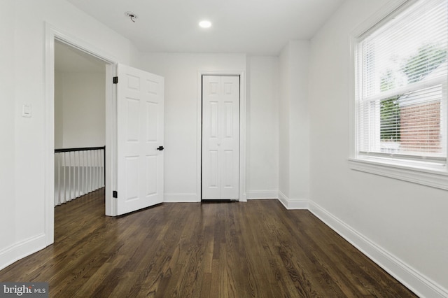 1964 Guy Way, Dundalk, MD 21222 - empty room featuring dark wood-type flooring, baseboards, a pendent fire sprinkler, and recessed lighting