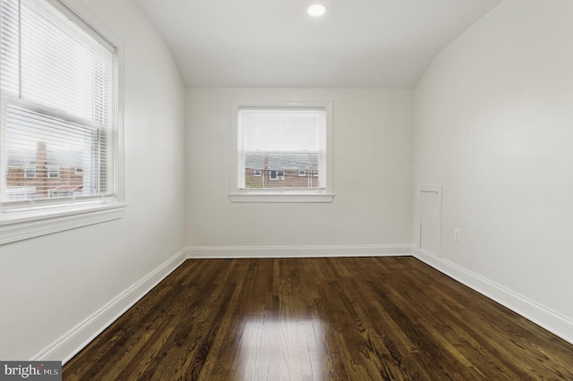 1964 Guy Way, Dundalk, MD 21222 - spare room with healthy amount of natural light, dark wood-type flooring, lofted ceiling, and baseboards