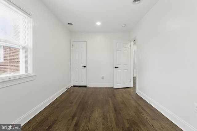 1964 Guy Way, Dundalk, MD 21222 - unfurnished bedroom with dark wood-style flooring, baseboards, and recessed lighting