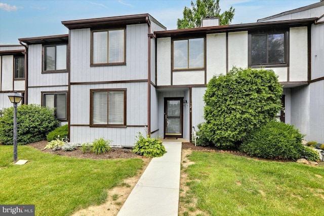 72 Azalea Way, Reading, PA 19606 - view of front of house featuring a front lawn and a chimney