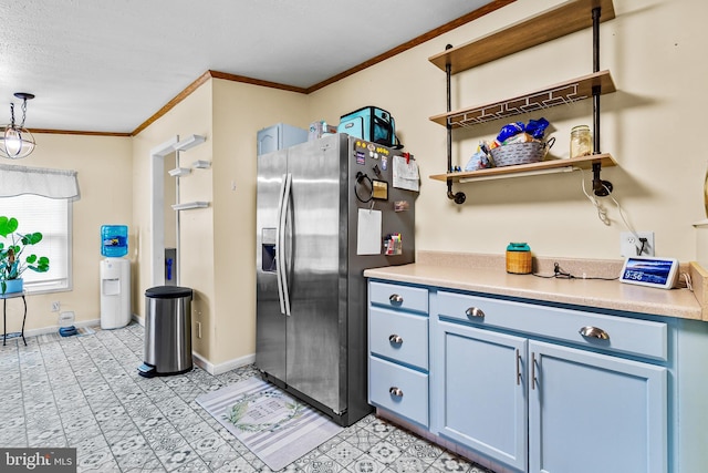 315 Robinhood Rd, Havre De Grace, MD 21078 - kitchen featuring stainless steel refrigerator with ice dispenser, ornamental molding, blue cabinets, light countertops, and baseboards