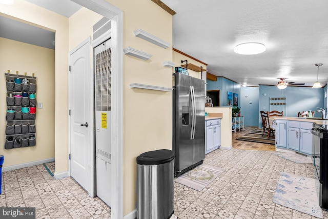 315 Robinhood Rd, Havre De Grace, MD 21078 - kitchen with stainless steel fridge with ice dispenser, ceiling fan, light countertops, blue cabinetry, and baseboards