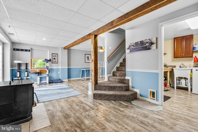 315 Robinhood Rd, Havre De Grace, MD 21078 - below grade area with a paneled ceiling, stairs, wood finished floors, a wood stove, and recessed lighting