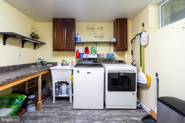 315 Robinhood Rd, Havre De Grace, MD 21078 - washroom with wood finished floors, washer and dryer, and cabinet space