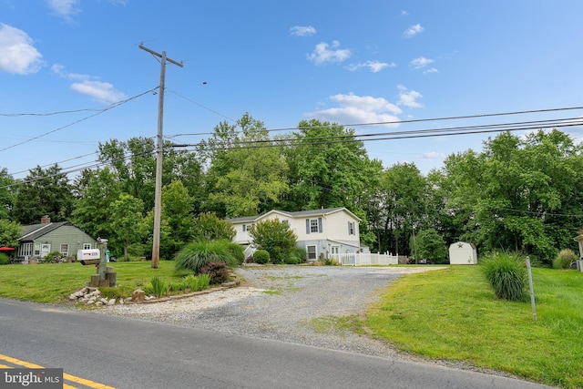 315 Robinhood Rd, Havre De Grace, MD 21078 - view of front of property featuring gravel driveway, view of wooded area, and a front lawn